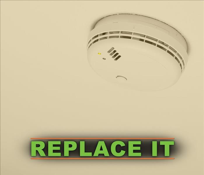 Smoke alarm with the phrase REPLACE IT